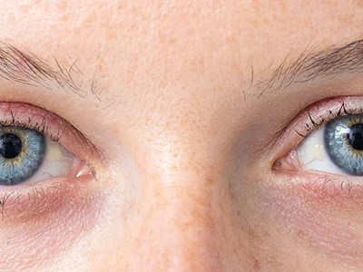Blue eye of young caucasian woman