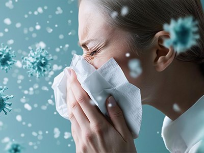 Young woman sneezing