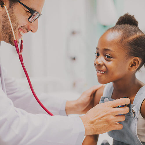 Health professional performing a chest exam with a stethoscope